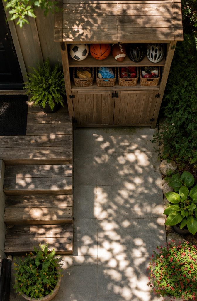Outdoor Cupboard Ideas for Storage, Pools, Gardens and Entertaining 7 An outdoor cabinet storing sports gear and cleaning supplies.